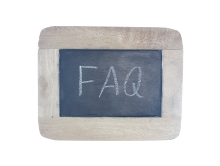 FAQ-frequently ask question,written with chalk on blackboard,isolated on white backgroundの写真素材
