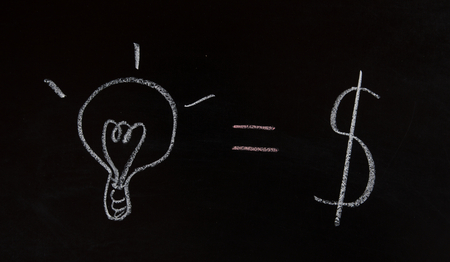business concept,idea = money written on blackboardの写真素材