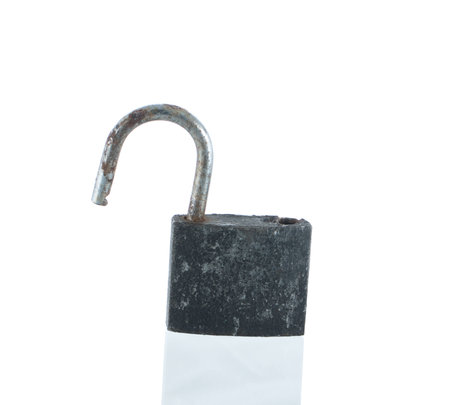 old padlock and reflection isolated on whiteの写真素材