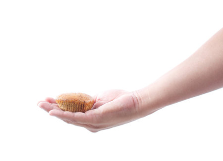hand holding banana muffin cake on white background