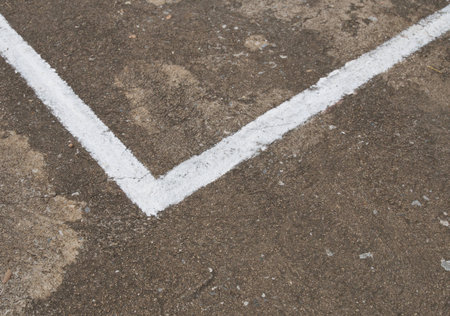 close up of white line on concrete court