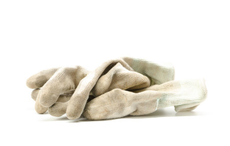 dirty gloves on white backgroundの写真素材