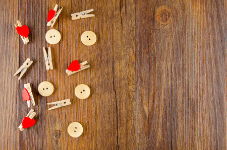 top view wooden sewing buttons and clothing clipsの写真素材