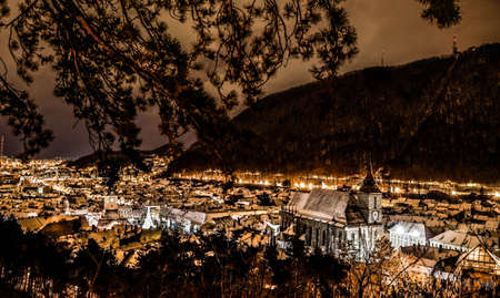 View of old town of Brasov in a cold winter nightの写真素材
