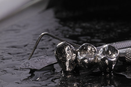 Metal crown and water dropsの写真素材