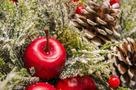 Christmas ornament closeup with apples and conesの写真素材