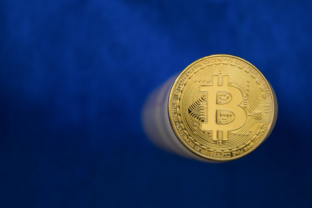 Bitcoin on a blue abstract background. Mining conceptの写真素材