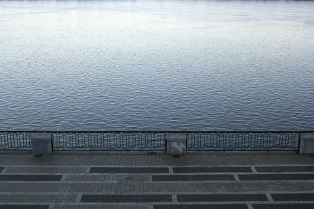 Top view of empty bridge road and river. Cool colors backgroundの写真素材