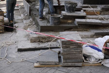 construction site with paving slabs material and worker in backgroundの写真素材