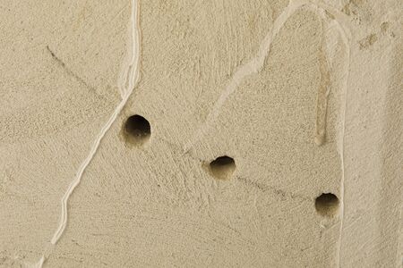 Electrical socket hole on concrete wall. Under construction electrical socket close upの写真素材