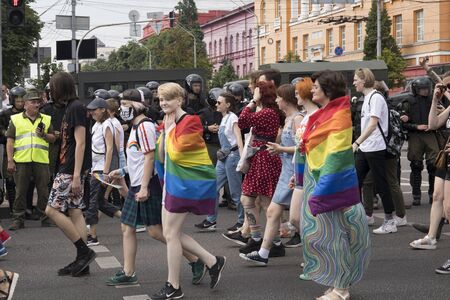 Kyiv, Ukraine June 23, 2019. The annual Pride Parade LGBT. People with posters and rainbow flags and police for safety of the parade.のeditorial素材