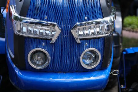 Close up shot of headlights and car exterior. Modern car conceptの写真素材