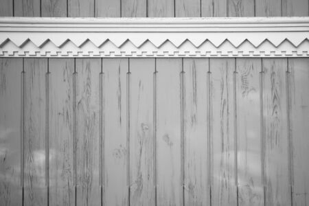 Vintage natural wooden grey color background with white carved elements textureの写真素材