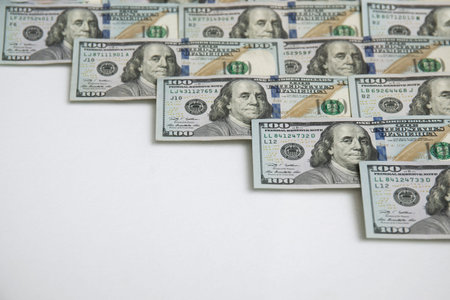 Pile of 100 US dollars bills background. One hundred. USA note. Top view. Flat lay. Business...