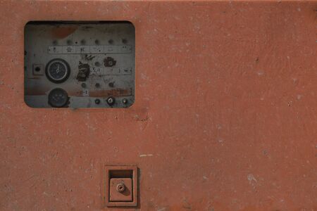 old road repair machine on the construction site, close-up of dirty partsの写真素材