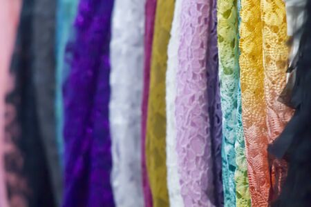 Color samples of a different fabric in shop with selective focus close upの写真素材