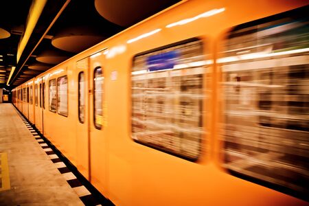A yellow train on the subway in Berlinの写真素材