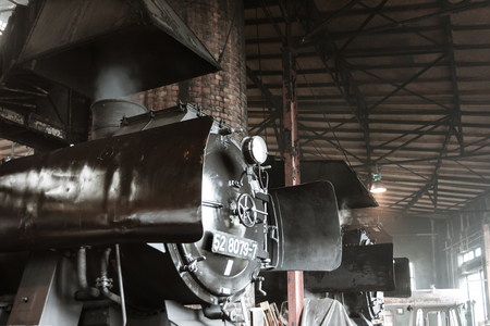 Old steam locomotive in a round houseのeditorial素材