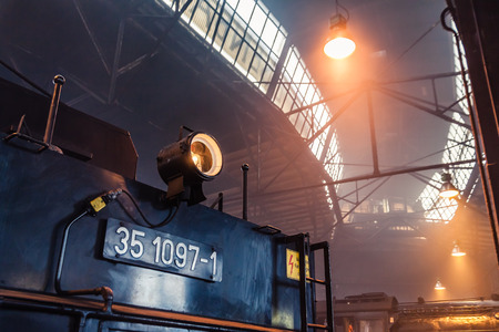 Old steam locomotive in a round houseのeditorial素材