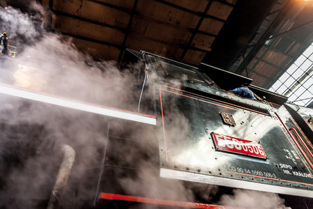 Old steam locomotive in a round houseのeditorial素材