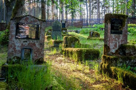 Gravestones of an old forgotten cemeteryの写真素材
