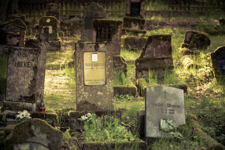 Gravestones of an old forgotten cemeteryの写真素材