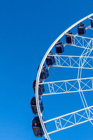 Ferris wheel carousel in motion on a festivalの写真素材