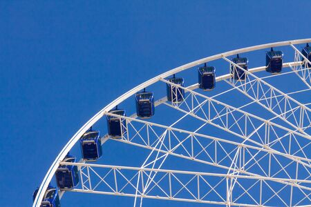 Ferris wheel carousel in motion on a festivalの写真素材