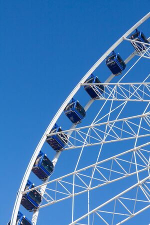 Ferris wheel carousel in motion on a festivalの写真素材