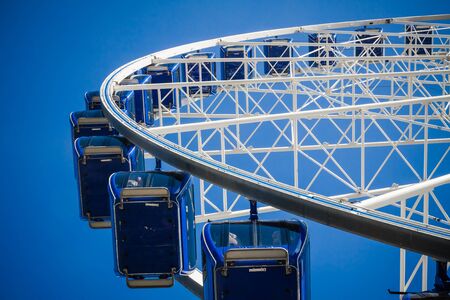 Ferris wheel carousel in motion on a festivalの写真素材