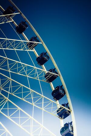 Ferris wheel carousel in motion on a festivalの写真素材