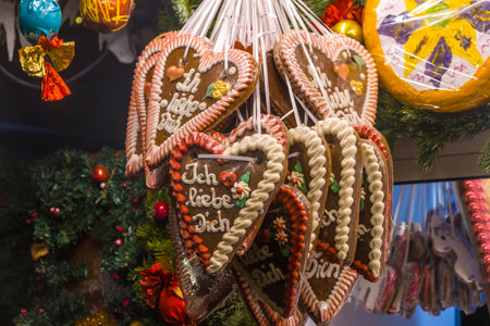 Christmas gingerbread in the shape of a heart on a Christmas treeの写真素材