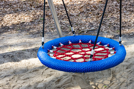 Close-up of a swing in the playground in the park.の写真素材