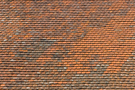 Roof of ancient Thai temple with red tile roof pattern background.の写真素材