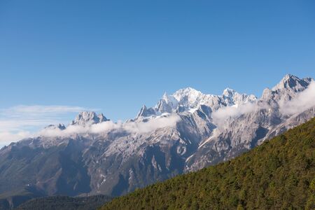 Jade Dragon Snow Mountain view from meadow. Most highest, fascinate and great mountain in Sichuan, Chinaの写真素材