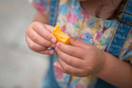 Child with cheeseの写真素材