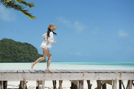 Beautiful women who enjoy the beach resortの写真素材