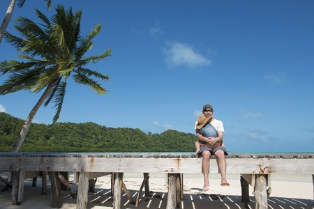 A father holding a daughterの写真素材