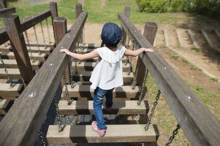 Little girl playing in the parkの写真素材