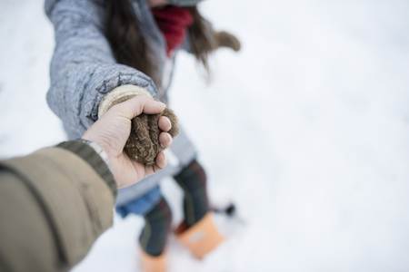 Little child holding hand with parentの写真素材