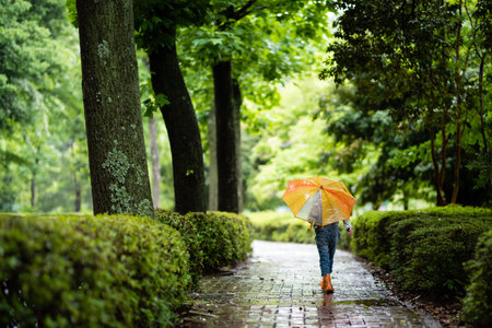 Cute girl walking with umbrella