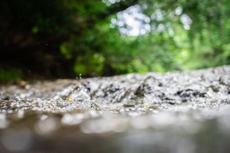 Close up of water flowing through the riverの写真素材