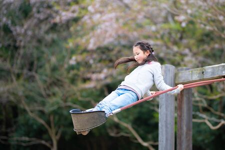 Girl playing in spring parの写真素材