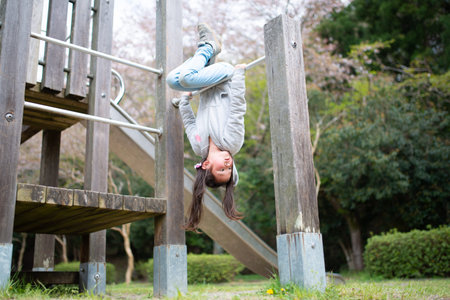 Girl playing in spring par