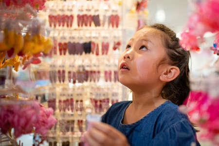 Cute girl who enjoy shoppingの写真素材