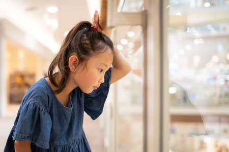 Cute girl who enjoy shoppingの写真素材