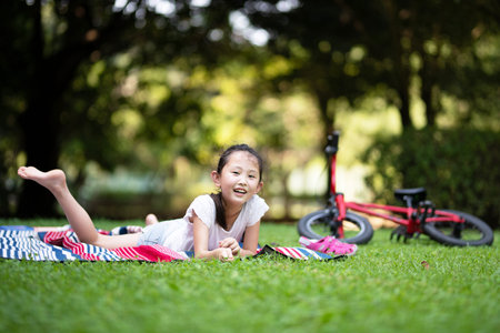 Girl having a picnic on the lawn