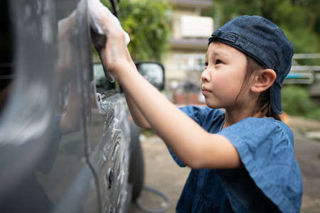Child washing carの写真素材
