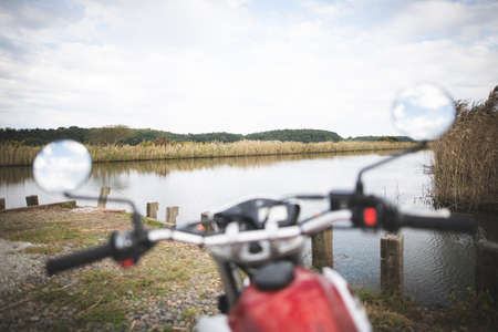 Motorcycles and rivers seen from inside the helmetの写真素材