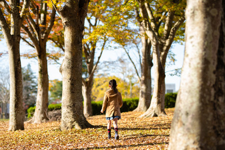 Girl playing in the autumn forest